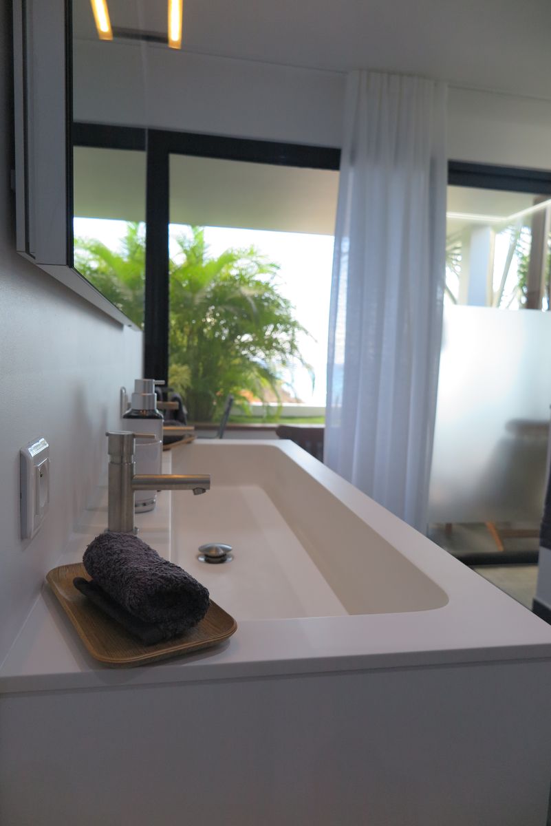 Bathroom basin with sea view